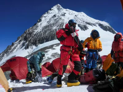 Mount Everest on the backdrop as members of an expedition team prepare to ascend the mountain, at Camp 4 in the Solukhumbu district, also known as the Everest region, Nepal, May 21, 2026. REUTERS/Purnima Shrestha