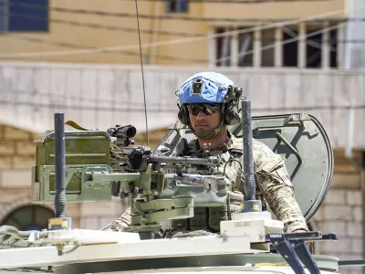Lebanon, Borj El Chmail (Burj el Shamali), 2026-04-29. An urban patrol in an armoured vehicle by the Finnish contingent of the United Nations Interim Force in Lebanon (UNIFIL) in a town in southern Lebanon. Engaged in a peacekeeping mission under a United Nations mandate, Finnish soldiers carry out presence and surveillance operations to contribute to the security of the area and the observance of the ceasefire, in coordination with the Lebanese Armed Forces and other international contingents. Photograph by Frederic Petry / Hans Lucas.Liban, Borj El Chmail (Burj el Shamali), 2026-04-29. Patrouille en zone urbaine en vehicule blinde du contingent finlandais de la Force interimaire des Nations unies au Liban (FINUL) dans une localite du sud du Liban. Engages dans une mission de maintien de la paix sous mandat des Nations unies, les soldats finlandais assurent des operations de presence et de surveillance afin de contribuer a la securite de la zone et au respect du cessez-le-feu le long, en coordination avec les forces armees libanaises et les autres contingents internationaux. Photographie de Frederic Petry / Hans Lucas.