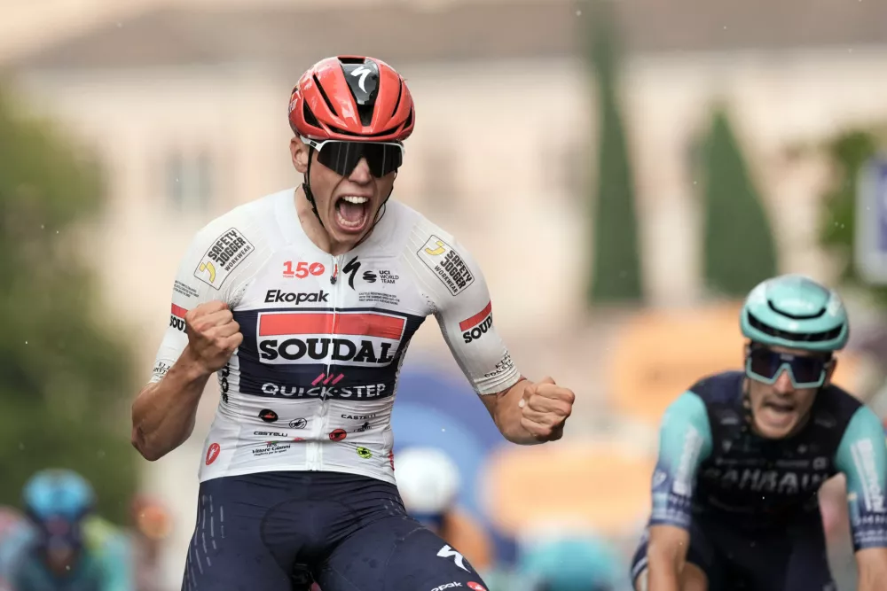 France's Paul Magnier of Soudal Quick-Step wins the 18th stage of the Giro d'Italia cycling race from Fai della Paganella to Pieve di Soligo, Italy, Thursday May 28, 2026. (Massimo PaoloneLaPresse via AP)