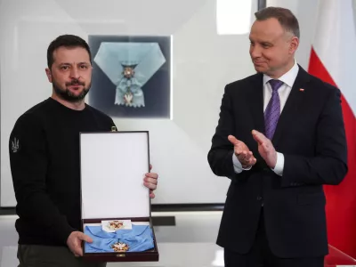 Poland's President Andrzej Duda honors Ukrainian President Volodymyr Zelenskiy with The Order of the White Eagle at the Presidential Palace in Warsaw, Poland, April 5, 2023. REUTERS/Kacper Pempel