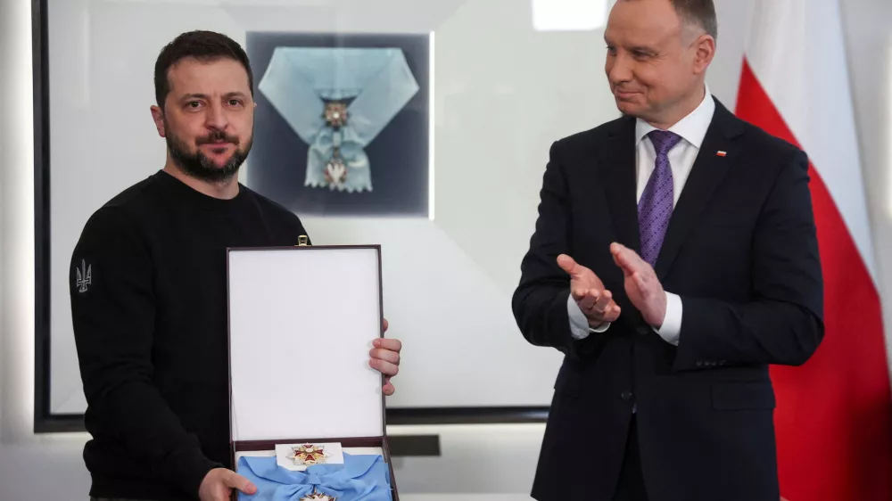 Poland's President Andrzej Duda honors Ukrainian President Volodymyr Zelenskiy with The Order of the White Eagle at the Presidential Palace in Warsaw, Poland, April 5, 2023. REUTERS/Kacper Pempel