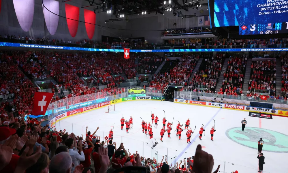 Ice Hockey - IIHF World Championships - Quarter Final - Switzerland v Sweden - Swiss Life Arena, Zurich, Switzerland - May 28, 2026 Switzerland players celebrate after the match REUTERS/Denis Balibouse