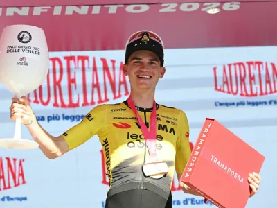 Cycling - Giro d'Italia - Stage 19 - Feltre to Alleghe - Italy - May 29, 2026 Team Visma - Lease a Bike's Sepp Kuss celebrates on the podium after winning stage 19 REUTERS/Jennifer Lorenzini