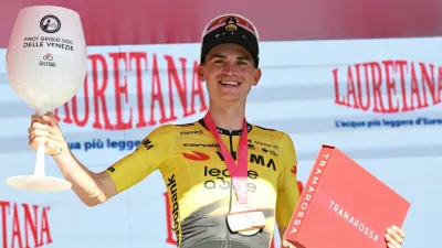 Cycling - Giro d'Italia - Stage 19 - Feltre to Alleghe - Italy - May 29, 2026 Team Visma - Lease a Bike's Sepp Kuss celebrates on the podium after winning stage 19 REUTERS/Jennifer Lorenzini