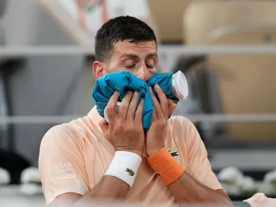 Novak Djokovic of Serbia reacts after the third round men's singles tennis match against Joao Fonseca of Brazil at the French Open tennis tournament in Paris, Friday, May 29, 2026. (AP Photo/Christophe Ena)