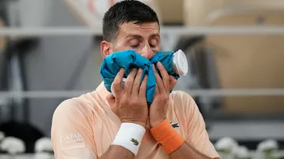 Novak Djokovic of Serbia reacts after the third round men's singles tennis match against Joao Fonseca of Brazil at the French Open tennis tournament in Paris, Friday, May 29, 2026. (AP Photo/Christophe Ena)