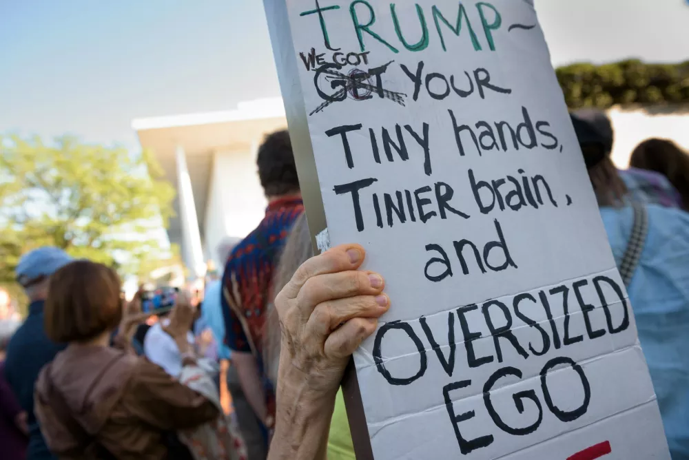 People hold a rally outside The John F. Kennedy Center for Performing Arts as they react to a judge's ruling in Washington, Friday, May 29, 2026. (AP Photo/Cliff Owen)