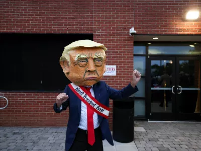 A man dressed in a costume depicting U.S. President Donald Trump walks at U.S. Representative Jim Clyburn's (D-SC) annual World Famous Fish Fry, at EdVenture Children's Museum in Columbia, South Carolina, U.S. May 29, 2026. REUTERS/Sam Wolfe