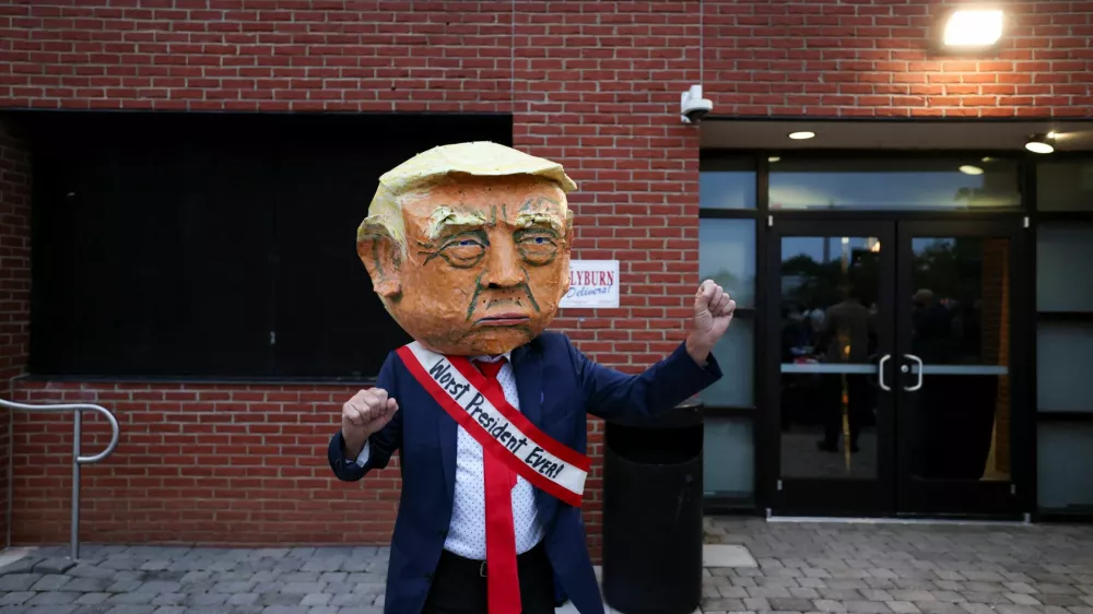 A man dressed in a costume depicting U.S. President Donald Trump walks at U.S. Representative Jim Clyburn's (D-SC) annual World Famous Fish Fry, at EdVenture Children's Museum in Columbia, South Carolina, U.S. May 29, 2026. REUTERS/Sam Wolfe