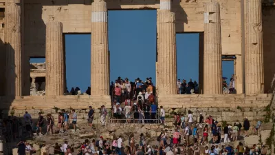 Tourists visit the 5th century BC Propylaea on the Acropolis Hill during a hot day, in Athens, Greece, Thursday, May 28, 2026.(AP Photo/Petros Giannakouris)