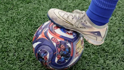 A player places a foot on a soccer ball with images of Ecuadorean soccer player Moises Caicedo that is used during practice at a Nino Moi 23 academy, a project led by Caicedo that focuses on bringing soccer to children in vulnerable communities, in the Guamani neighborhood, in Quito, Ecuador May 18, 2026. REUTERS/Karen Toro