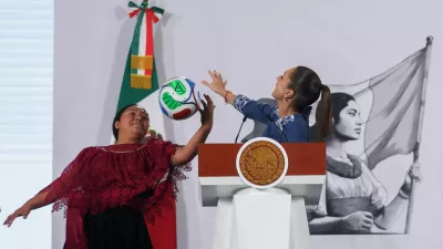 Yolett Cervantes Cuaquehua plays with a ball alongside Mexican President Claudia Sheinbaum after receiving a ticket from her for the opening match of the 2026 World Cup, the June 11 Mexico&ndash;South Africa game at Ciudad de Mexico Stadium, during Sheinbaum's morning press conference at the National Palace in Mexico City, Mexico, May 29, 2026. REUTERS/Quetzalli Nicte-Ha   TPX IMAGES OF THE DAY