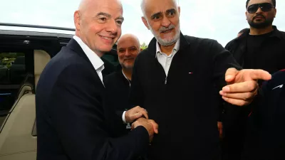 Soccer Football - International Friendly - Costa Rica v Iran - Antalya Stadium, Antalya, Turkey - March 31, 2026 First vice president of the Islamic Republic of Iran Football Federation Mehdi Mohammad Nabi shakes hands with FIFA president Gianni Infantino before the match REUTERS/Kaan Soyturk