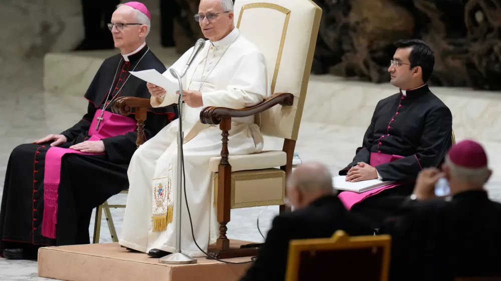 Pope Leo XIV delivers his message as he meets with members of the Catholic Charismatic Renewal movement in the Paul VI Hall at the Vatican, Saturday, May 30, 2026. (AP Photo/Gregorio Borgia)