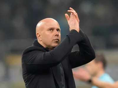 FILE - Liverpool's manager Arne Slot applauds at the end of a Champions League, league phase, soccer match between Inter Milan and Liverpool in Milan, Italy, Tuesday, Dec.9, 2025. (AP Photo/Luca Bruno, File)