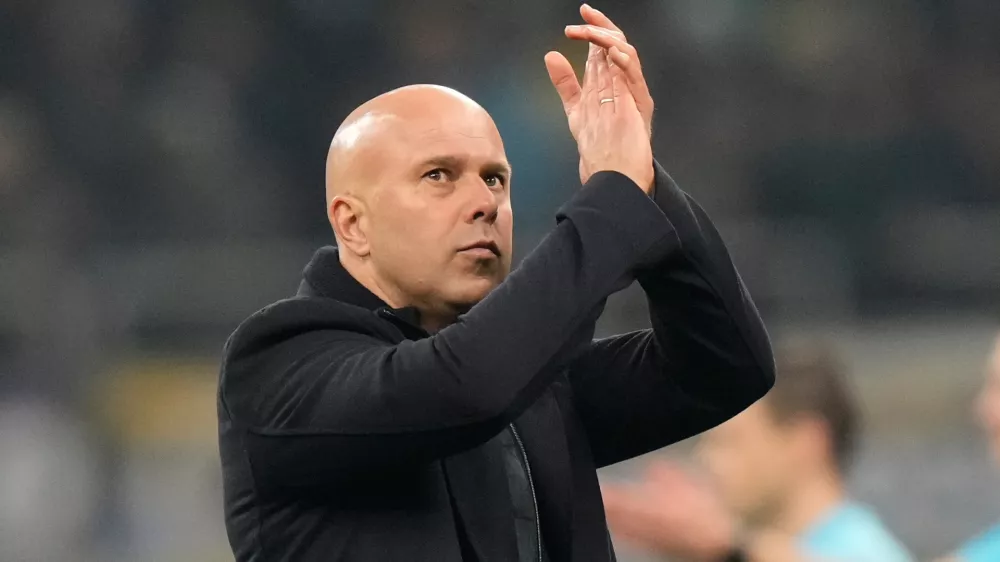 FILE - Liverpool's manager Arne Slot applauds at the end of a Champions League, league phase, soccer match between Inter Milan and Liverpool in Milan, Italy, Tuesday, Dec.9, 2025. (AP Photo/Luca Bruno, File)