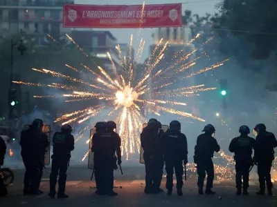 Soccer Football - UEFA Champions League - Paris St Germain fans in Paris watch the Final - Parc des Princes, Paris, France - May 30, 2026 General view of police in the streets as a firework is set off REUTERS/Abdul Saboor   TPX IMAGES OF THE DAY