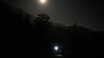 A blue moon rises behind mountain in San Jose de Maipo outskirts of capital Santiago, Chile, Saturday, May 30, 2026. (AP Photo/Esteban Felix)