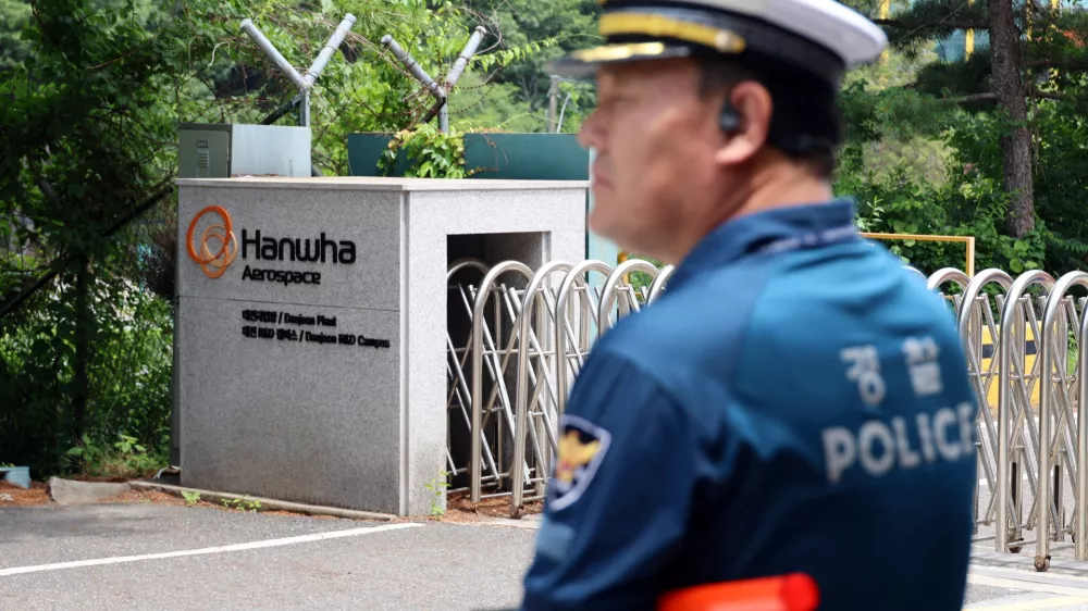 A police officer controls the area in front of the main gate of Hanwha Aerospace's factory that caught fire after an explosion, in Daejeon, South Korea, June 1, 2026.  Yonhap via REUTERS  THIS IMAGE HAS BEEN SUPPLIED BY A THIRD PARTY. NO RESALES. NO ARCHIVES. SOUTH KOREA OUT. NO COMMERCIAL OR EDITORIAL SALES IN SOUTH KOREA.