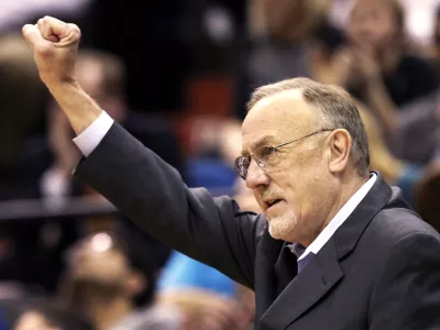 FILE - Minnesota Timberwolves head coach Rick Adelman celebrates a defensive rebound by Ricky Rubio in the second half of an NBA basketball game against Oklahoma City Thunder, March 29, 2013,in Minneapolis. (AP Photo/Jim Mone, File)
