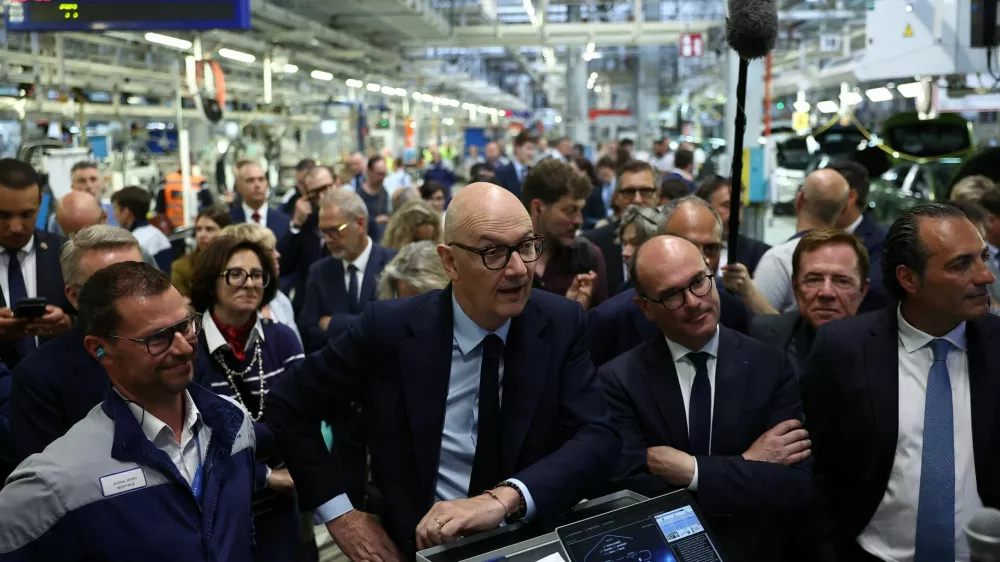 French Minister for Economy, Finance, and Industrial, Energy and Digital Sovereignty Roland Lescure, French Junior Minister in charge of Industry Sebastien Martin, and Antonio Filosa, CEO of Stellantis, listen to explanations during a visit at the Stellantis factory in Mulhouse, eastern France, June 2, 2026. REUTERS/Alice Sacco