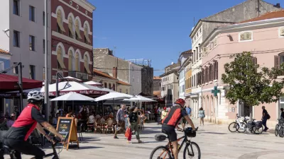 Porec, Croatia, Istria - September 25, 2023: People in Freedom Square (Trg Slobode) in Old Town, the largest and most popular square in the city