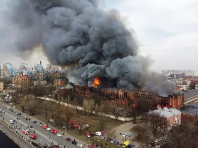 Flames and smoke rise during a fire at the Nevskaya Manufaktura factory in central Saint Petersburg, Russia April 12, 2021. Picture taken with a drone. REUTERS/Anton Vaganov