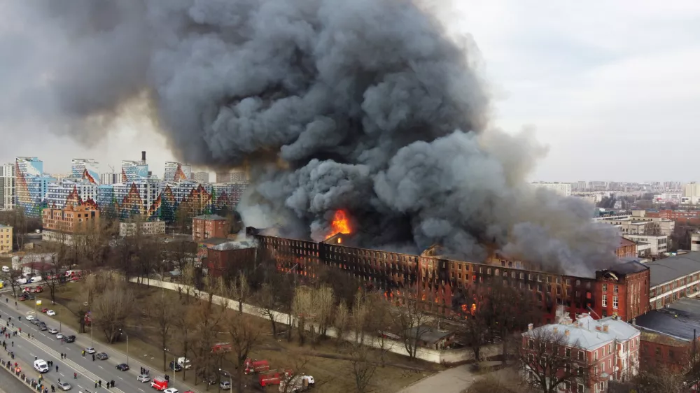 Flames and smoke rise during a fire at the Nevskaya Manufaktura factory in central Saint Petersburg, Russia April 12, 2021. Picture taken with a drone. REUTERS/Anton Vaganov