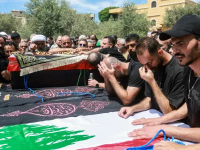 Mourners attend the funeral of Lebanese parents Hassan Abdullah and Hanan Shehab and their children Leen, Ali, Ibraheem and Julia, who were killed in an Israeli strike, in Wardaniyeh, Lebanon, June 3, 2026. REUTERS/Aziz Taher