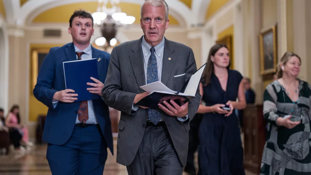 Sen. Dan Sullivan, R-Alaska, heads to a closed-door meeting with fellow Republicans, at the Capitol in Washington, Tuesday, June 2, 2026. (AP Photo/J. Scott Applewhite)
