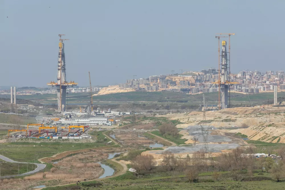April 5, 2026: Istanbul, Turkey, April 5, 2026: The under-construction Sazlidere Bridge, designed to span the future canal waterway, constitutes the largest transportation infrastructure built to date under Canal Istanbul, while the adjacent Sazlidere Reservoir remains a crucial source of drinking water for Istanbul. Amid ongoing tender and financing uncertainties surrounding Canal Istanbul, bridge, housing and infrastructure works continue in phases across the project area, while rising costs, environmental concerns and limited international funding are placing the overall timeline under renewed scrutiny. Canal Istanbul is a planned artificial waterway in Istanbul designed to connect the Black Sea to the Sea of Marmara as an alternative shipping route to the Bosphorus.,Image: 1089118364, License: Rights-managed, Restrictions:, Model Release: no 