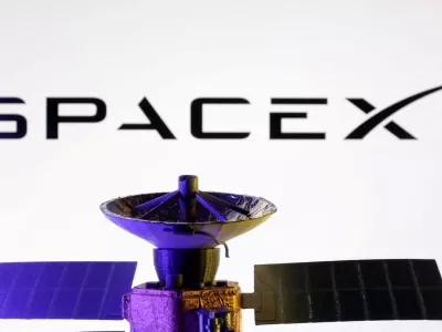 FILE PHOTO: SpaceX logo and miniature satellite model are seen in this illustration taken, March 10, 2025. REUTERS/Dado Ruvic/Illustration/File Photo