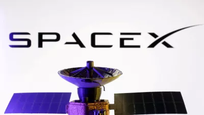FILE PHOTO: SpaceX logo and miniature satellite model are seen in this illustration taken, March 10, 2025. REUTERS/Dado Ruvic/Illustration/File Photo