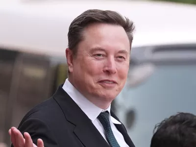 FILE - Elon Musk departs after a welcome ceremony with President Donald Trump and China's President Xi Jinping at the Great Hall of the People, Thursday, May 14, 2026, in Beijing. (AP Photo/Mark Schiefelbein, File)