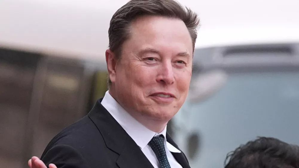 FILE - Elon Musk departs after a welcome ceremony with President Donald Trump and China's President Xi Jinping at the Great Hall of the People, Thursday, May 14, 2026, in Beijing. (AP Photo/Mark Schiefelbein, File)