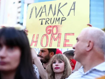 A demonstrator holds a banner as they protest against a luxury resort, a plan by a company linked with Donald Trump's son-in-law Jared Kushner, in a protected area, in Tirana, Albania, June 2, 2026. REUTERS/Florion Goga