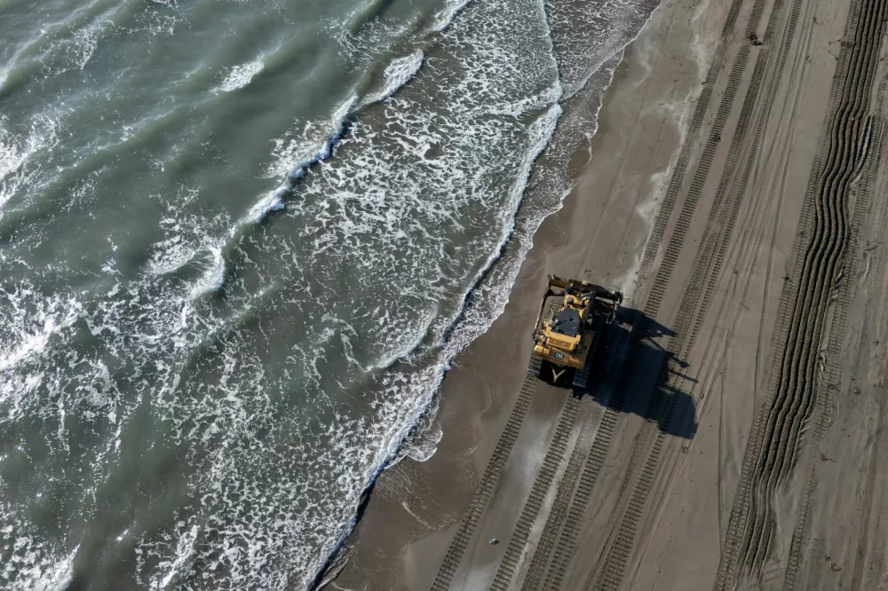A drone view of a heavy vehicle driving inside the Vjosa-Narte protected area, where a luxury resort is planned by a company linked with Donald Trump's son-in-law, Jared Kushner, near Vlora, Albania, May 9, 2026. REUTERS/Fatos Bytyci