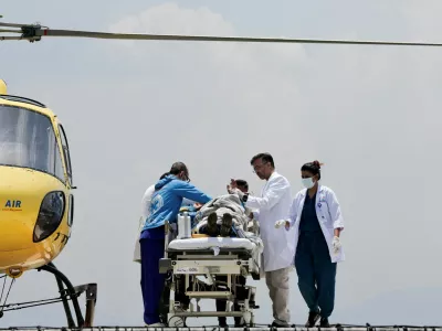 Paramedics work to transport Dawa Sherpa, who was missing for several days in the Everest region, from the helipad at HAMS Hospital in Kathmandu, Nepal, June 4, 2026. REUTERS/Navesh Chitrakar