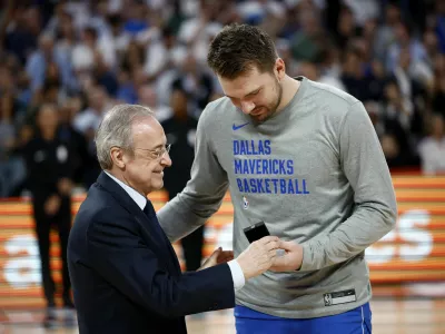 Basketball - International Friendly - Real Madrid v Dallas Mavericks - WiZink Center, Madrid, Spain - October 10, 2023 Real Madrid president Florentino Perez gives a badge to Dallas Mavericks' Luka Doncic before the match REUTERS/Juan Medina