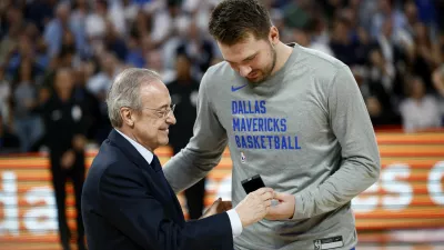 Basketball - International Friendly - Real Madrid v Dallas Mavericks - WiZink Center, Madrid, Spain - October 10, 2023 Real Madrid president Florentino Perez gives a badge to Dallas Mavericks' Luka Doncic before the match REUTERS/Juan Medina