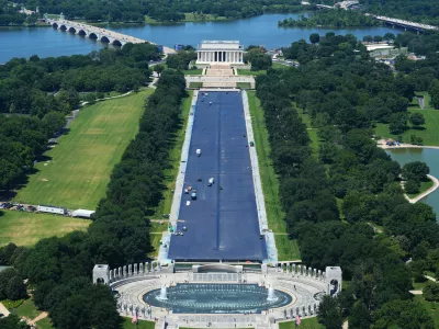 Work continues on the Lincoln Memorial Reflecting Pool, Thursday, June 4, 2026, as seen from the Washington Monument in Washington. (AP Photo/Stephanie Scarbrough)
