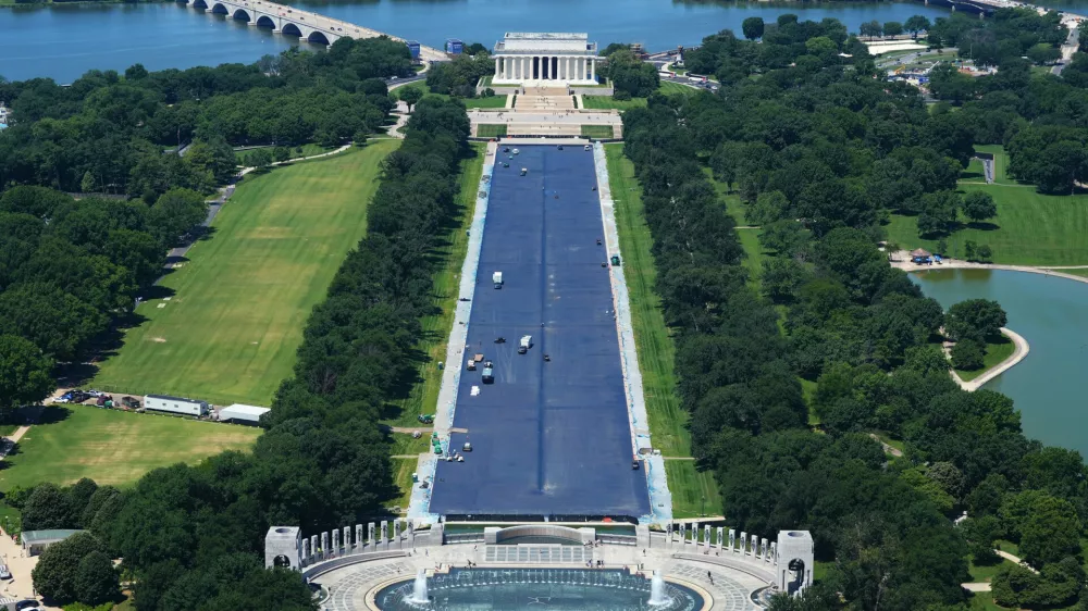 Work continues on the Lincoln Memorial Reflecting Pool, Thursday, June 4, 2026, as seen from the Washington Monument in Washington. (AP Photo/Stephanie Scarbrough)