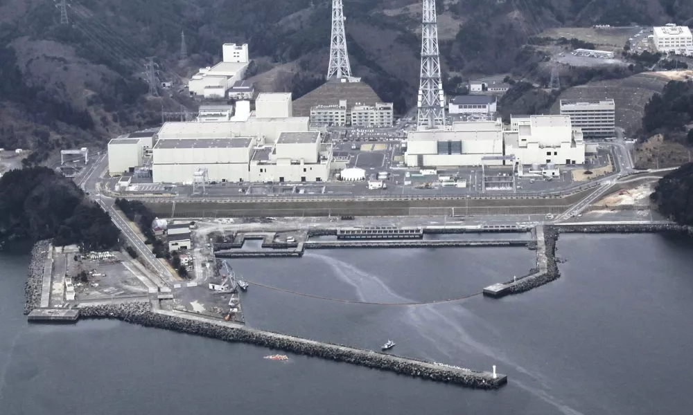 An aerial view shows Onagawa Nuclear Power Plant is seen at Miyagi Prefecture in this photo taken by Yomiuri Shimbun on April 8, 2011. Water leaked out of spent fuel pools at the Onagawa nuclear plant in northeast Japan after a strong aftershock rocked the region late on Thursday, but there was no change in the radiation levels outside the plant, operator Tohoku Electric Power said on Friday. Mandatory credit REUTERS/Yomiuri Shimbun (JAPAN - Tags: DISASTER ENERGY ENVIRONMENT) JAPAN OUT. NO COMMERCIAL OR EDITORIAL SALES IN JAPAN. FOR EDITORIAL USE ONLY. NOT FOR SALE FOR MARKETING OR ADVERTISING CAMPAIGNS. THIS IMAGE HAS BEEN SUPPLIED BY A THIRD PARTY. IT IS DISTRIBUTED, EXACTLY AS RECEIVED BY REUTERS, AS A SERVICE TO CLIENTS. YES