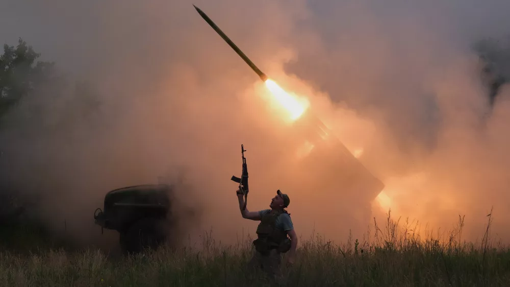 In this photo provided by Ukraine's 93rd Kholodnyi Yar Separate Mechanized Brigade press service, a soldier reacts as an MRLS BM-21 "Grad" fires at the Russian positions near Kostiantynivka, Donetsk region, Ukraine, Thursday, June 4, 2026. (Iryna Rybakova/Ukraine's 93rd Mechanized Brigade via AP)