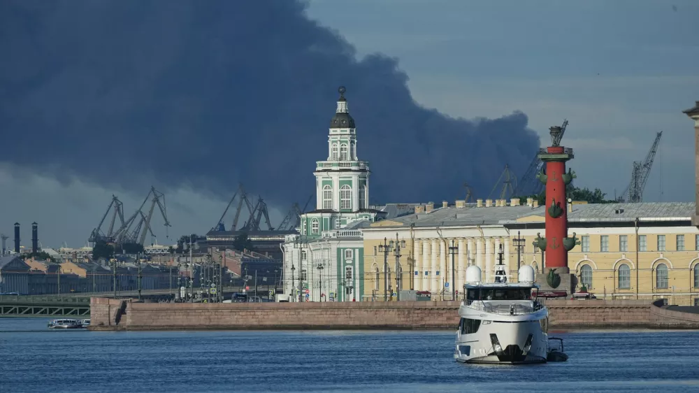 A plume of black smoke is seen over the port of St. Petersburg, Russia, Wednesday, June 3, 2026, after a Ukrainian drone attack. (AP Photo)