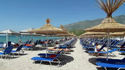 A view of a beach in the Orikum near the city of Vlore, some 180 km (113 miles) south of Albania's capital Tirana, June 10, 2009. By closing Albania to the outside world, its Communist leaders preserved vast swaths of virgin Mediterranean coastline from unbridled development. Yet trash and sewage from the consumer and construction explosion after communism endanger the pristine beauty that could fuel future economic growth through tourism. Picture taken June 10, 2009. To match feature ALBANIA-TRASH/    REUTERS/Stringer (ALBANIA ENVIRONMENT TRAVEL)