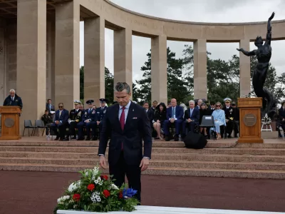 U.S. Defense Secretary Pete Hegseth lays a wreath of flowers during a ceremony at the US cemetery to commemorate the 82nd anniversary of the D-Day landings, in Colleville-sur-Mer, Normandy, France, Saturday, June 6, 2026. (AP Photo/Jeremias Gonzalez)