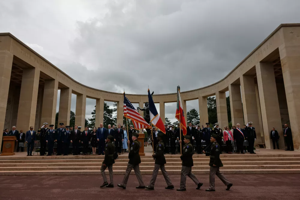 U.S. Defense Secretary Pete Hegseth, center left, attends a ceremony at the US cemetery to commemorate the 82nd anniversary of the D-Day landings, in Colleville-sur-Mer, Normandy, France, Saturday, June 6, 2026. (AP Photo/Jeremias Gonzalez)