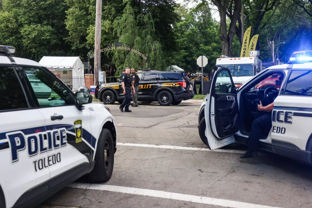 Toledo police investigates a shooting that left 12 people injured at the Old West End Festival at the Agnes Reynolds Jackson Arboretum in Toledo, Ohio on Saturday, June 6, 2026. (Rebecca Benson/The Blade via AP)