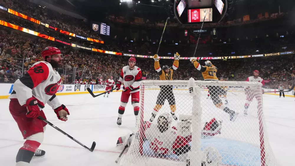 Carolina Hurricanes left wing Jordan Martinook (48) reacts after Vegas Golden Knights defenseman Shea Theodore scored during the the second overtime in Game 3 of the NHL hockey Stanley Cup Final series, Saturday, June 6, 2026, in Las Vegas. (AP Photo/Candice Ward)